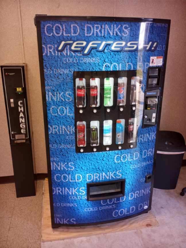 Cold drink vending machine with change machine available on-site at Double Time RV Park in Alvin, Texas